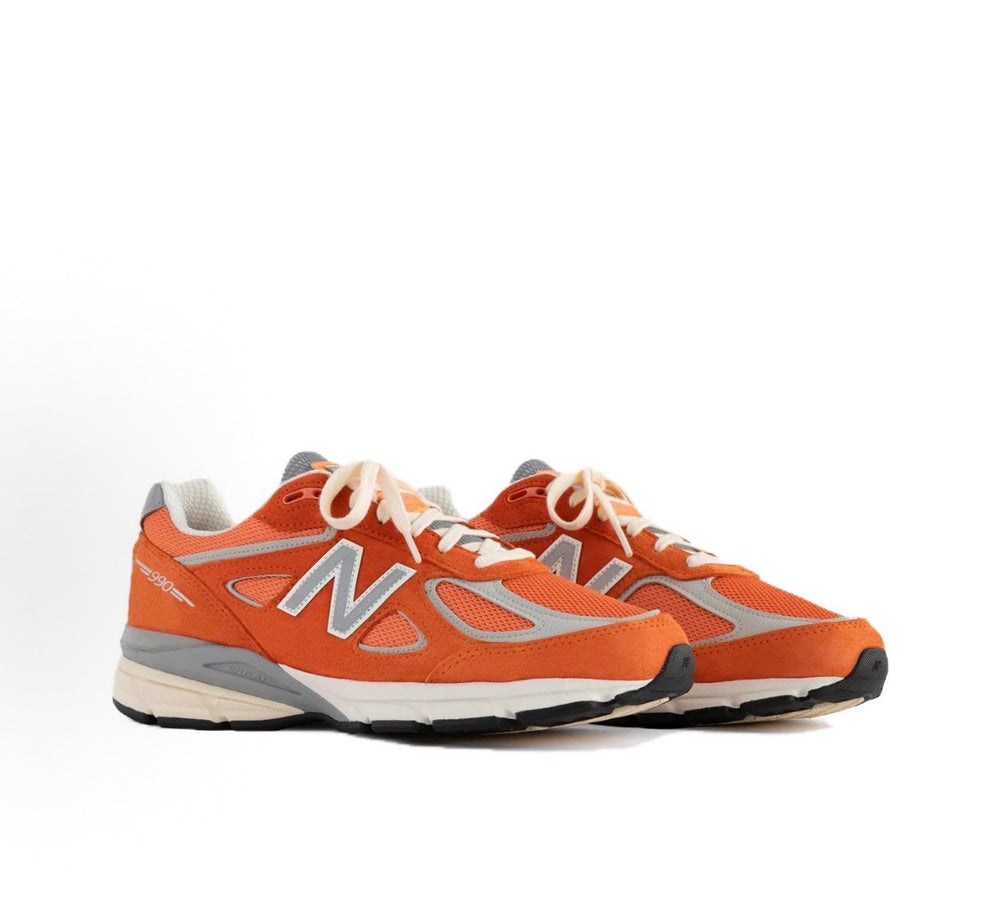 New Balance 990 sneakers, orange upper with New Balance N logo, white laces