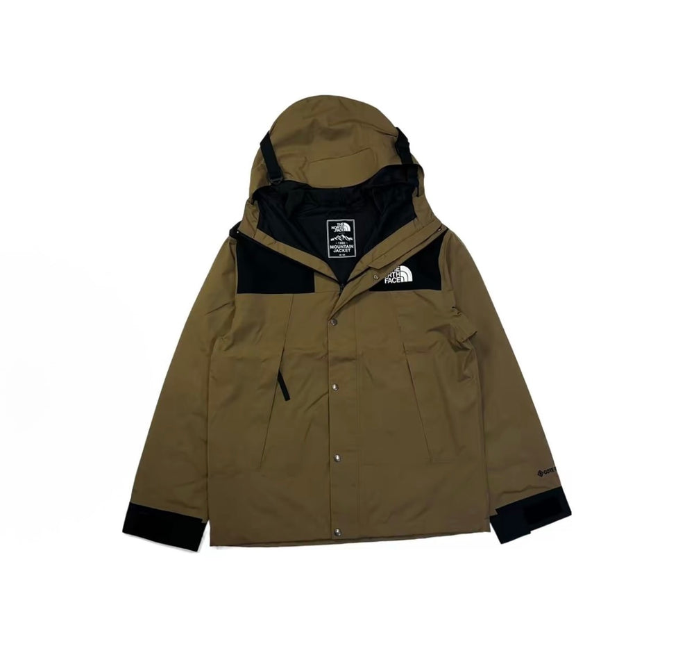 Tan hooded jacket with black inner lining, drawcord hood, and front logo